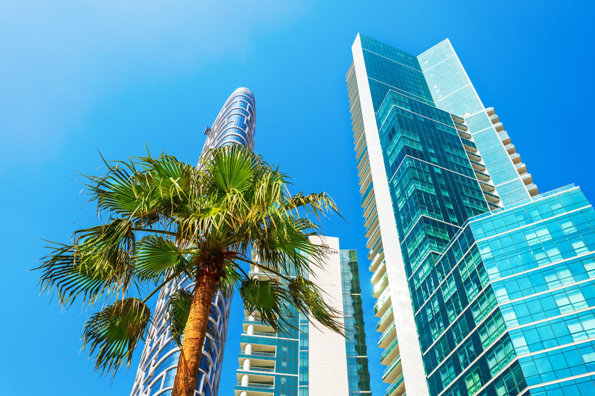 Modern skyscrapers in Dubai Emirate, UAE. Rent or sell, real estate concept.